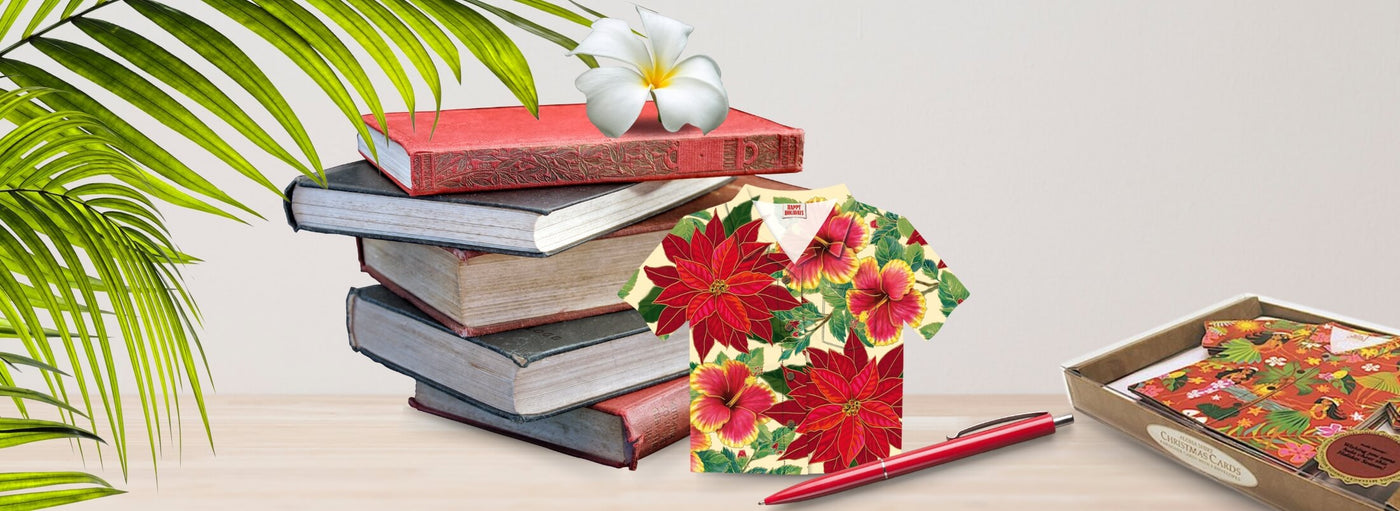 Island Heritage's Aloha Shirt Christmas cards collection banner, featuring festive Hawaiian designs to add a tropical touch to your holiday greetings