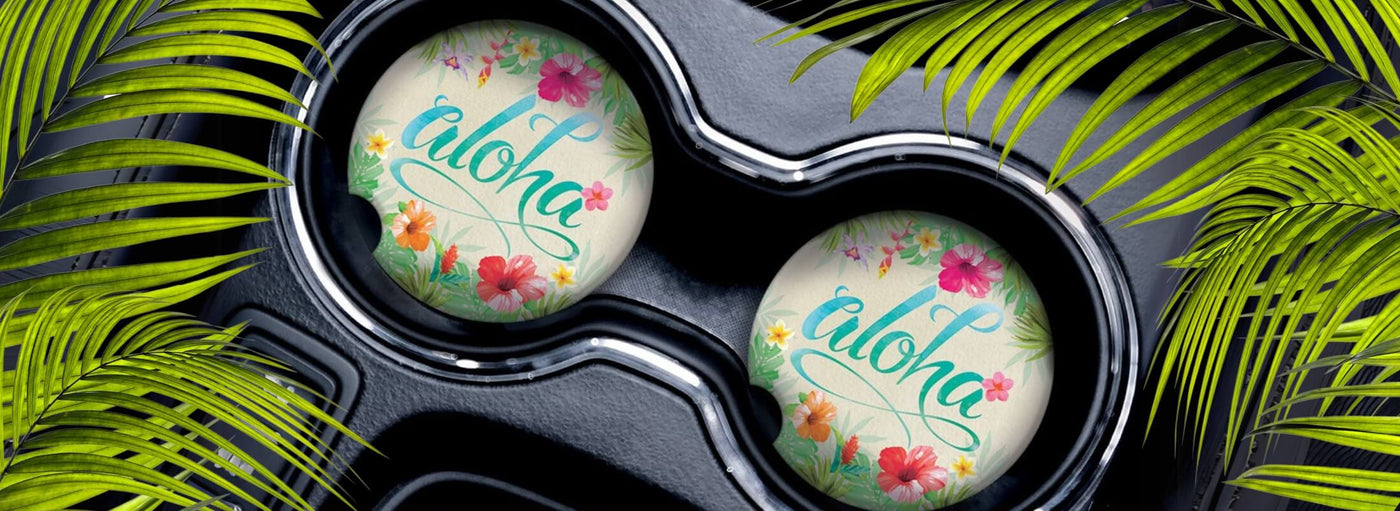 Island Heritage's Car Coasters Hawaii Collection banner, featuring vibrant, Hawaiian-inspired coasters designed to add a tropical touch to your vehicle