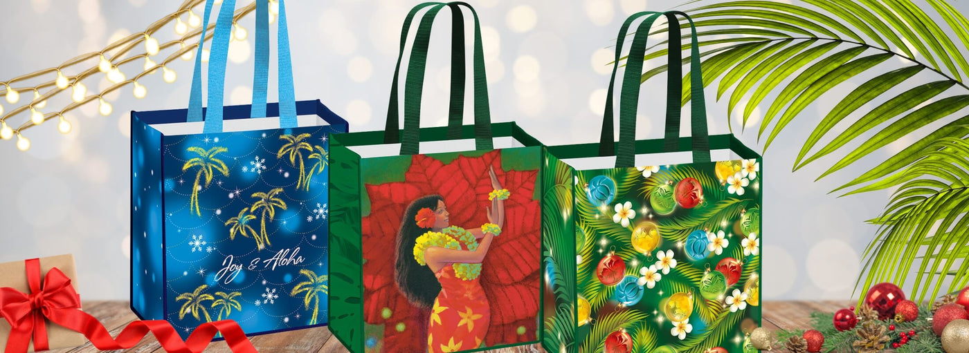 Island Heritage's Christmas tote bags collection banner, featuring festive Hawaiian-inspired designs perfect for holiday shopping and gifting