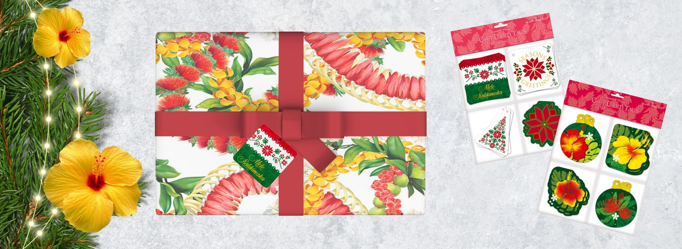 Banner with tropical flowers, a Hawaii lei wrapped Christmas gift, and packaged of gift card tags.