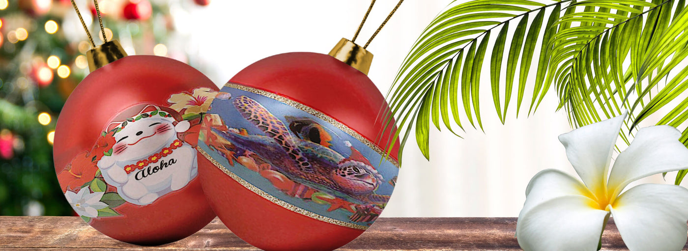 Banner with tropical plants and flowers, Christmas tree with lights, red round ornaments with turtle and aloha cat.