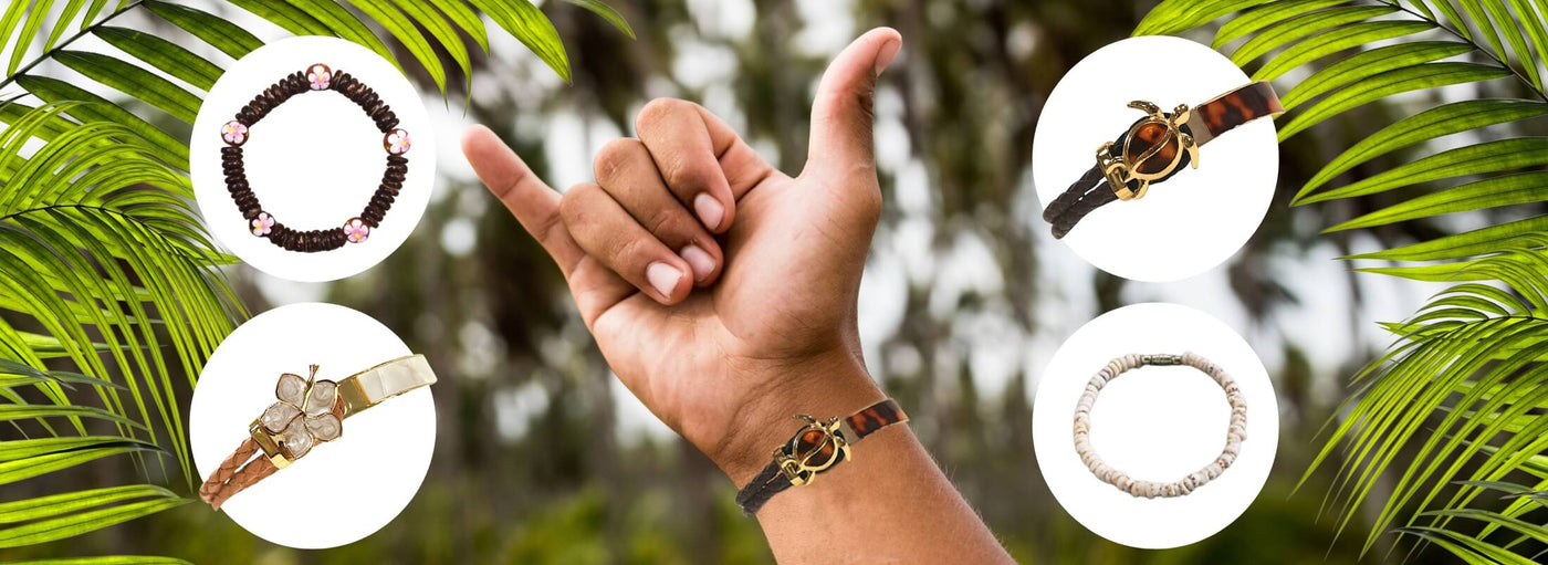 banner with tropical leaves background. A hand doing a shaka, wearing a turtle bracelet. four white circles displaying bracelets.