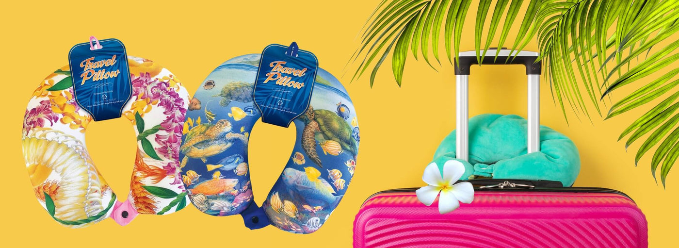 Banner with yellow background, tropical plants and flowers, a pink suitcase and Hawaii themed neck pillows.