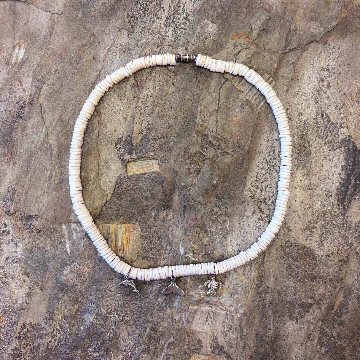 White clam shell necklace with three island-themed charms for a tropical look