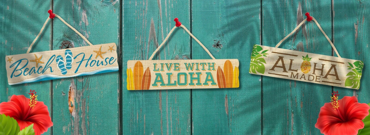 Teal wood with Hawaii aloha beach signs hanging.