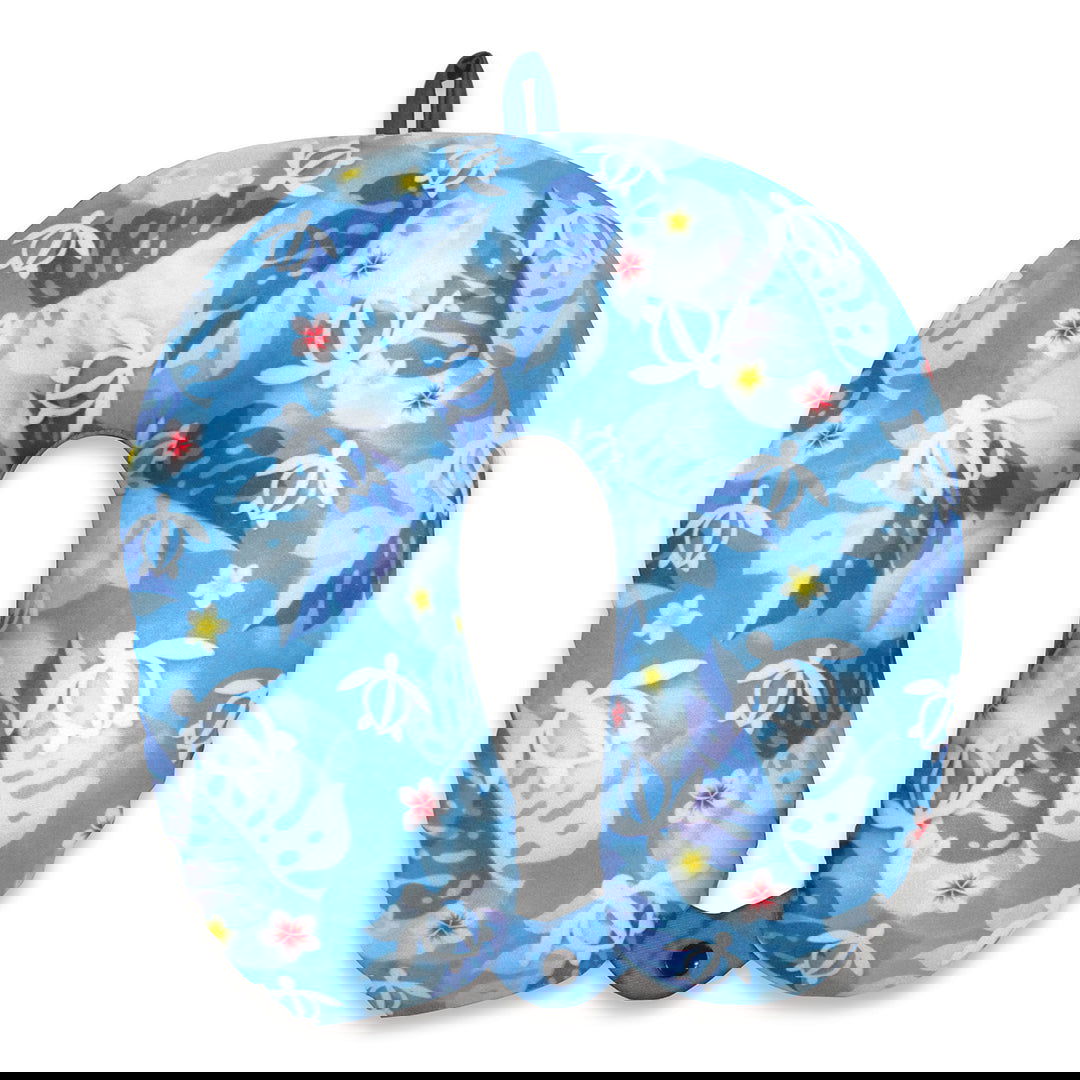 Travel neck pillow featuring a Honu Floral design, showcasing colorful sea turtles and tropical floral patterns, perfect for comfort on the go.