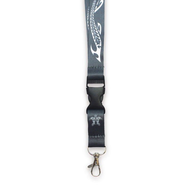 A black lanyard with a lobster clasp and a tribal honu design, detachable bottom half, for holding keys or ID cards.