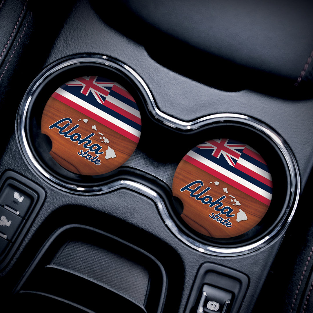 a car's cupholders with car accessory Aloha state