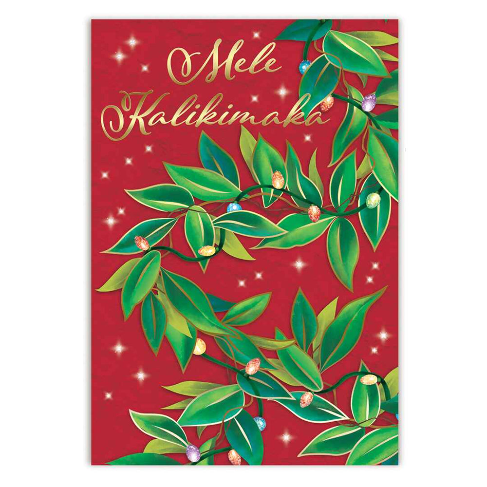 A Christmas card with a red background, featuring green foliage and the text 'Mele Kalikimaka' in gold.