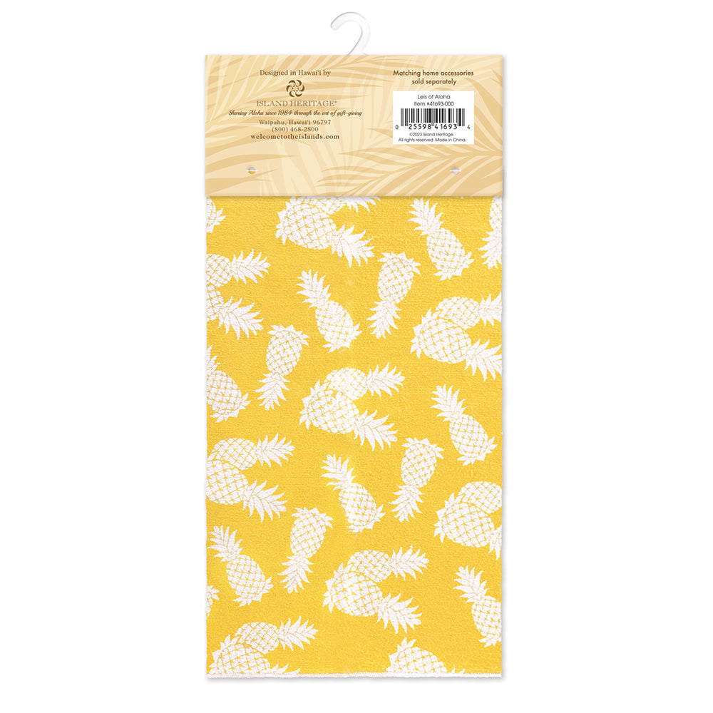 A packaged yellow with white pineapples kitchen mat,
