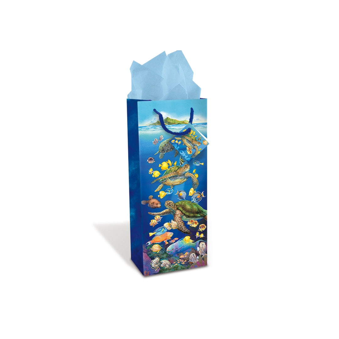 A tall Hawaii underwater sea turtle themed wine bag with tissue paper in it.