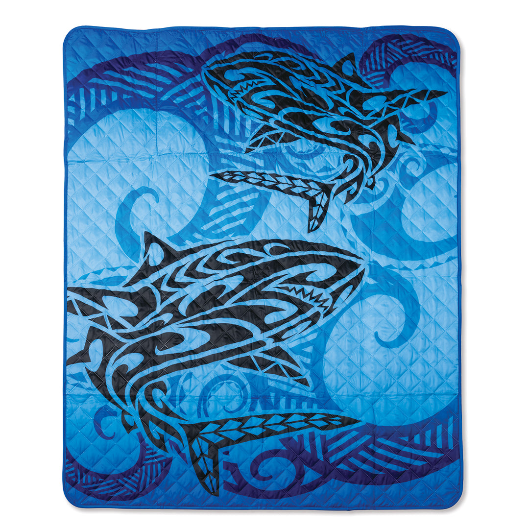 Front of blue tribal beach mat with black sharks