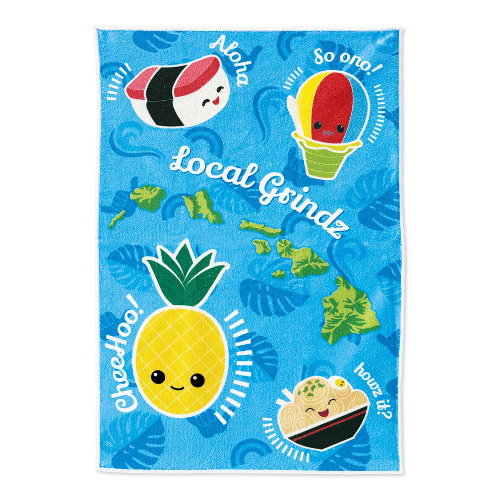 Colorful towel with cartoon Hawaiian food characters and text on a blue background