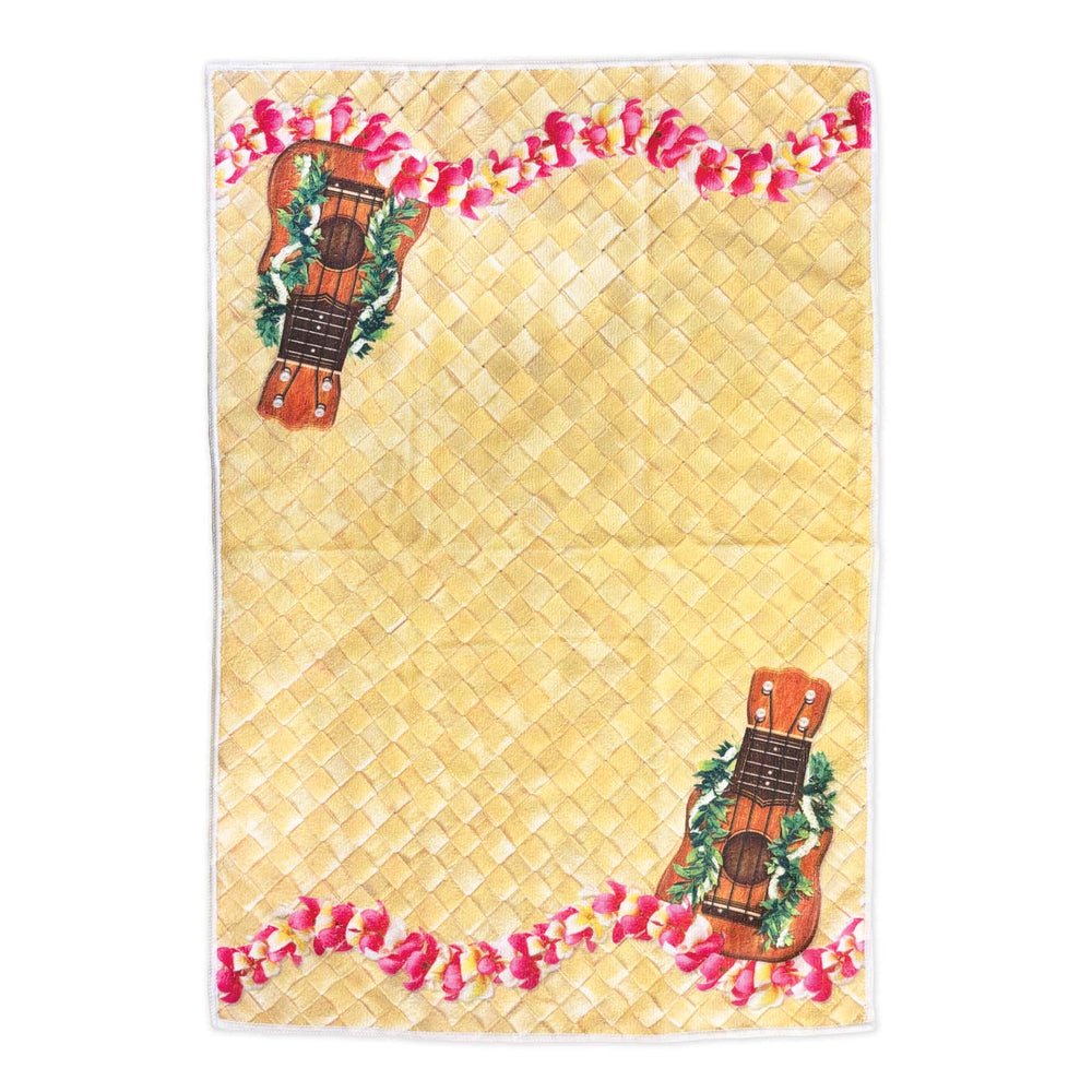 Decorative mat with woven pattern, ukuleles, and pink lei on a white background