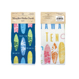Two microfiber kitchen towels with surfboard designs in packaging on a white background