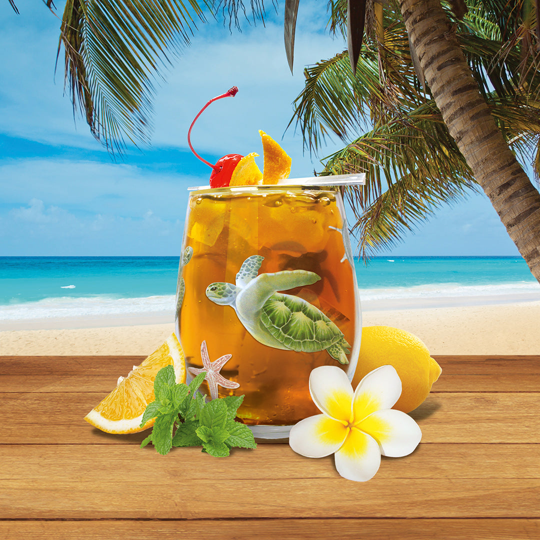 Hawaii beach scene with filled glass cup with image of a sea turtle
