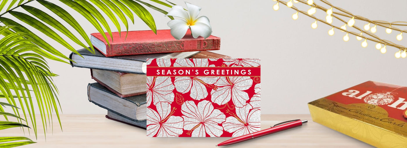 Island Heritage's Deluxe Christmas cards collection banner, featuring luxurious tropical-themed designs perfect for holiday greetings