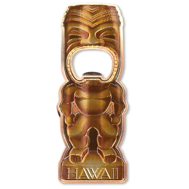 Magnetic bottle opener shaped like a surfboard, displaying a bold Chanting Tiki design with traditional Hawaiian art elements.