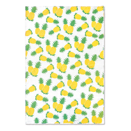 A white microfiber kitchen towel with pineapples.
