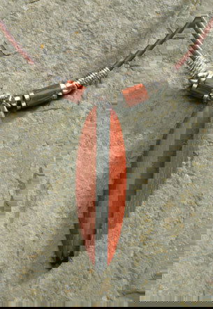 Rubber cord necklace featuring a wooden surfboard pendant made from bayong wood, showcasing a stylish and tropical-inspired design.