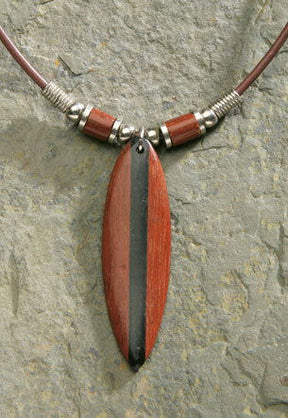 Rubber cord necklace featuring a wooden surfboard pendant made from bayong wood, showcasing a stylish and tropical-inspired design.
