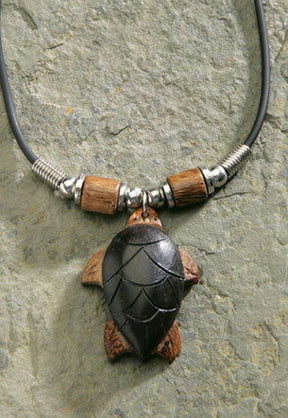 Rubber cord necklace featuring a wooden turtle pendant, showcasing a unique and stylish design inspired by tropical themes.