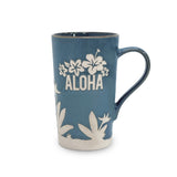 Blue mug with white floral designs and 'ALOHA' text on a white background