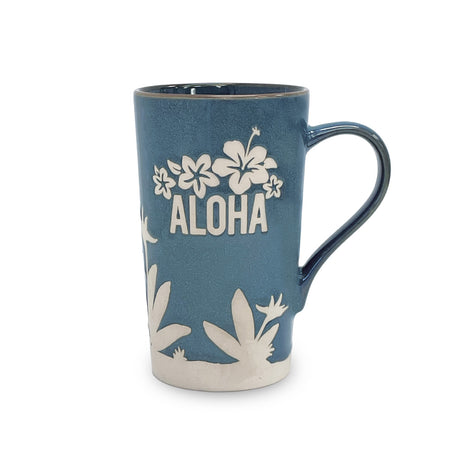 Blue mug with white floral designs and 'ALOHA' text on a white background