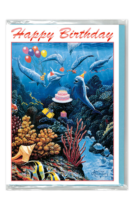 Birthday card with an underwater scene featuring dolphins and a cake, with 'Happy Birthday' text at the top.