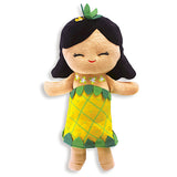 The front of a plush girl with black hair and a pineapple dress