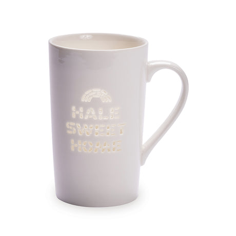 Hale sweet home words on a white tall mug.