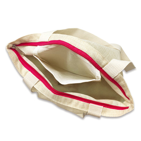 a top view of a tan tote back with a red zipper opened