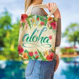 A lifestyle image of a model holding a Hawaii aloha tote over her sholder. 