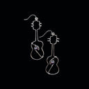 Silver  Ukulele Earrings with Black Pearls, showcasing their unique design and lightweight structure