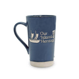 dark blue mug with 'Our Island Heritage' text and logo on a white background