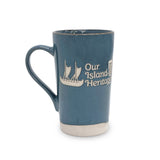 Blue mug with 'Our Island Heritage' text and logo on a white background