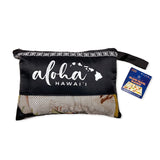 A black mesh zipped package of an island travel blanket with words aloha Hawaii and a map of the islands