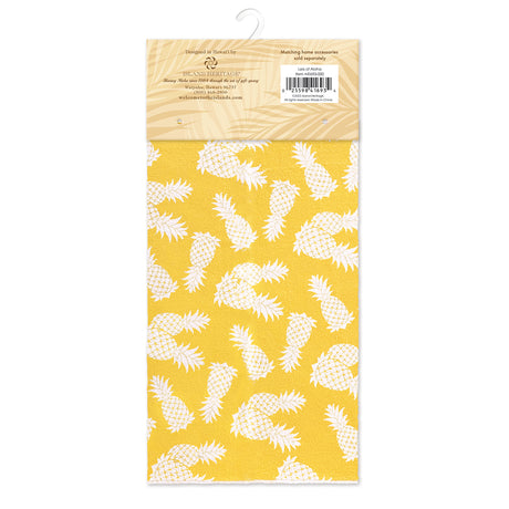 A packaged yellow with white pineapples kitchen mat,